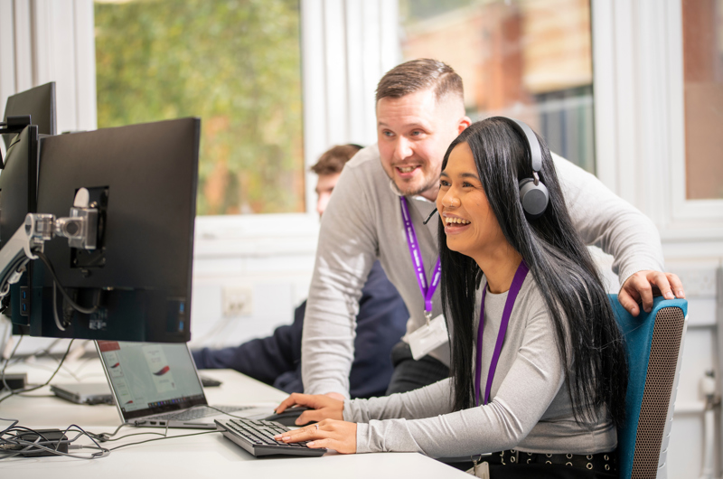 Line manager and employee working on query