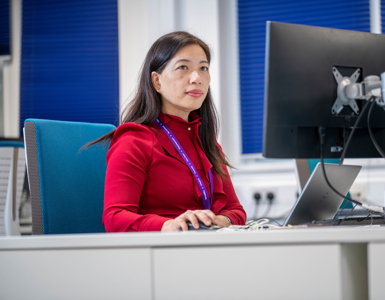 Finance employee working at laptop