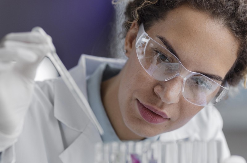 Front View Female Researcher Laboratory With Safety Glasses Test Tubes