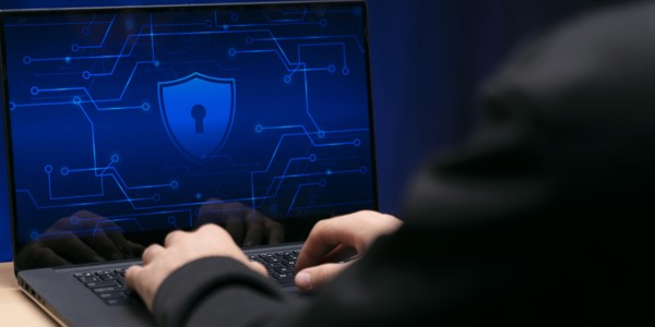 Cyber criminal on laptop